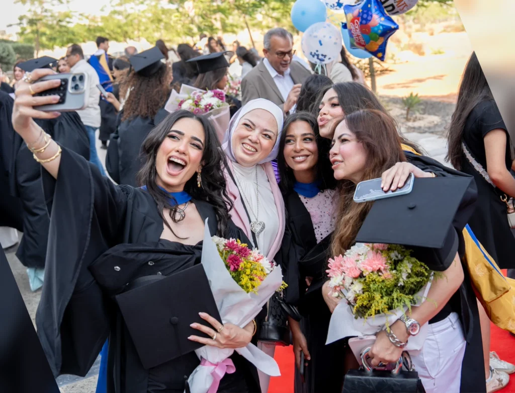 TKH graduates celebrating at commencement