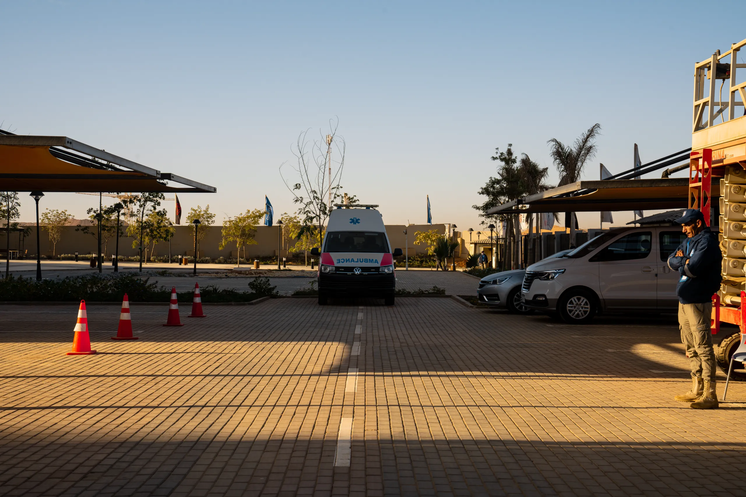 360° panorama of the TKH campus entrance and parking plaza at sunset